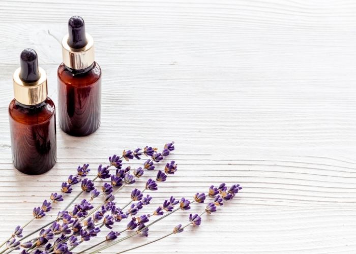 Essential oils bottles with a lavender stem
